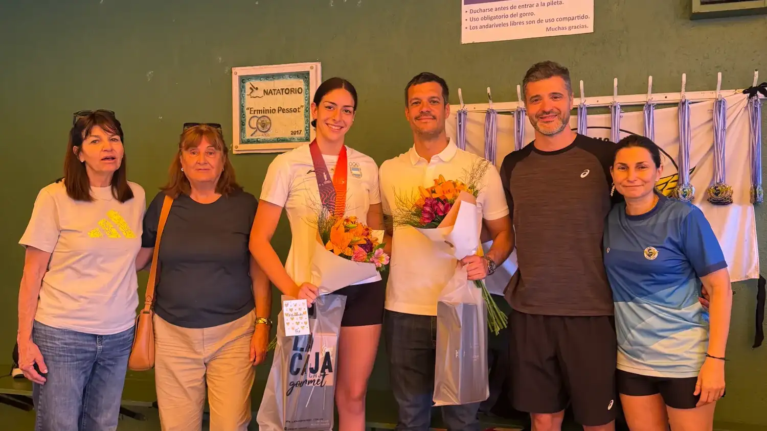 Malena Santillán y Andrés “Negro” González homenajeados en su club.