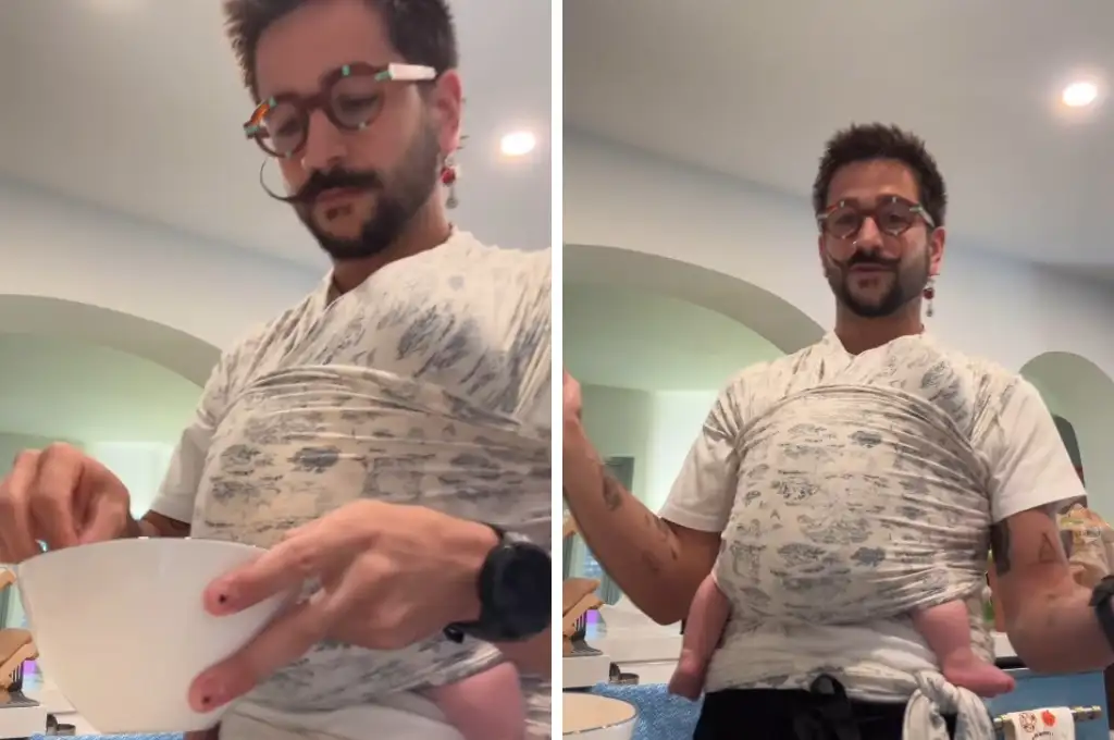 Camilo con su bebé en brazos.